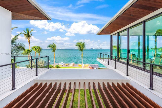 balcony featuring a water view