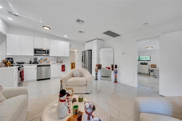 living room featuring sink