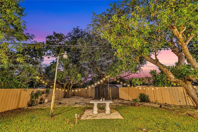 view of yard with a fenced backyard