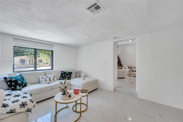 living room featuring a textured ceiling