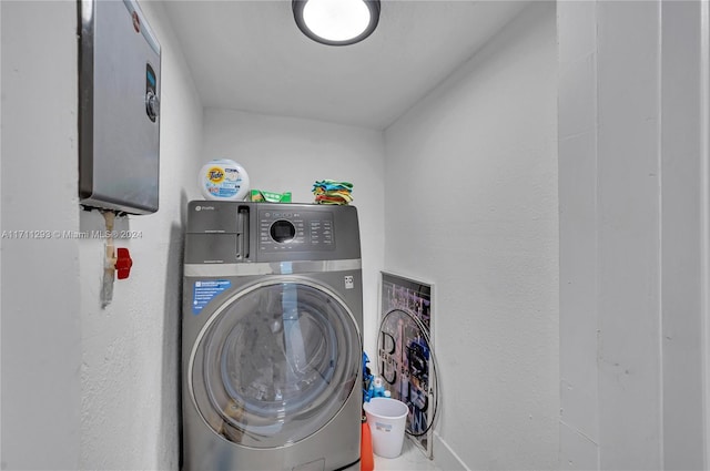 clothes washing area featuring washer / clothes dryer