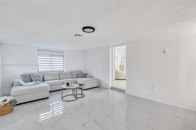 living room with marble finish floor, visible vents, and baseboards