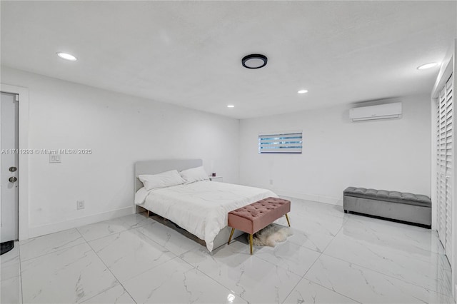bedroom featuring an AC wall unit, baseboards, recessed lighting, and marble finish floor