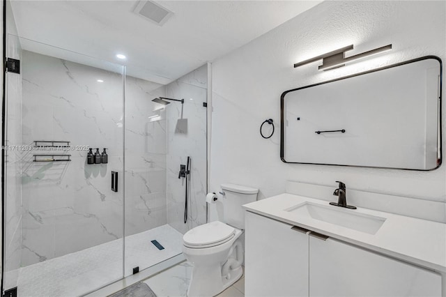 full bathroom featuring vanity, toilet, a marble finish shower, visible vents, and marble finish floor
