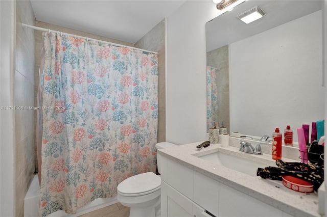 full bathroom featuring tile patterned flooring, shower / tub combo, vanity, and toilet