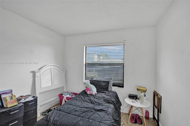 bedroom featuring a textured ceiling