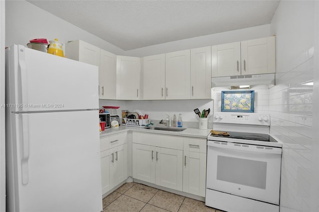 kitchen featuring a textured ceiling, white cabinetry, white appliances, and sink