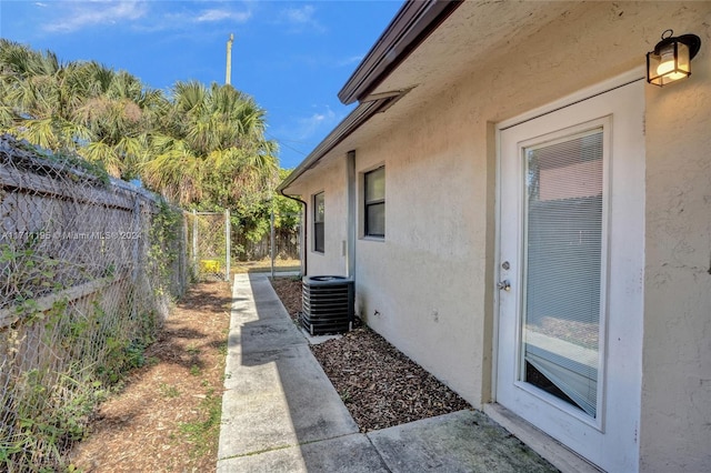 view of side of home featuring central AC unit