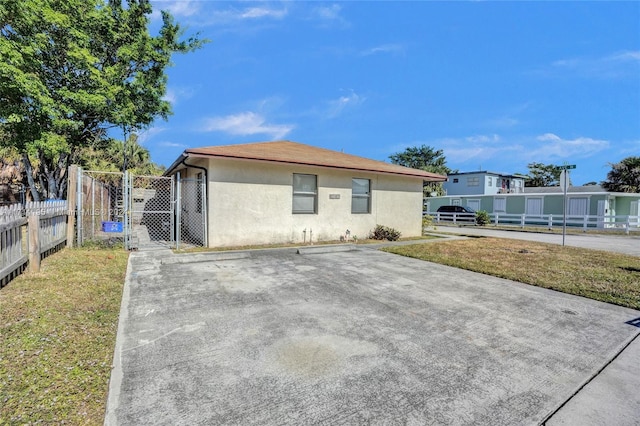 rear view of property with a lawn