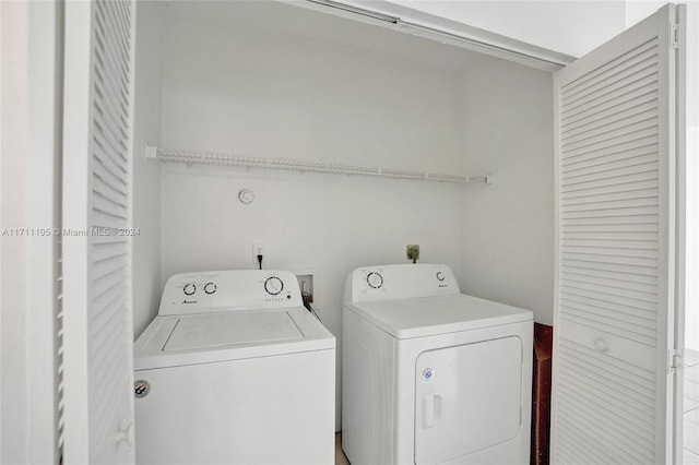 laundry area with independent washer and dryer