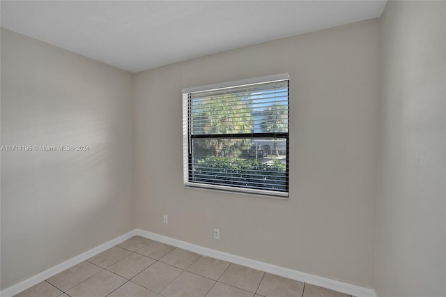 empty room featuring light tile patterned floors