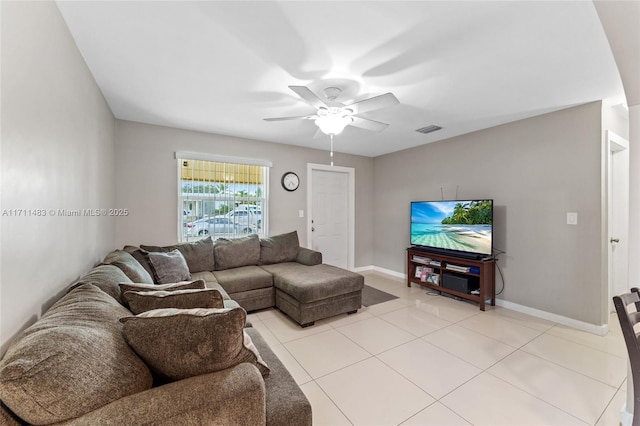 living room with ceiling fan and light tile patterned flooring