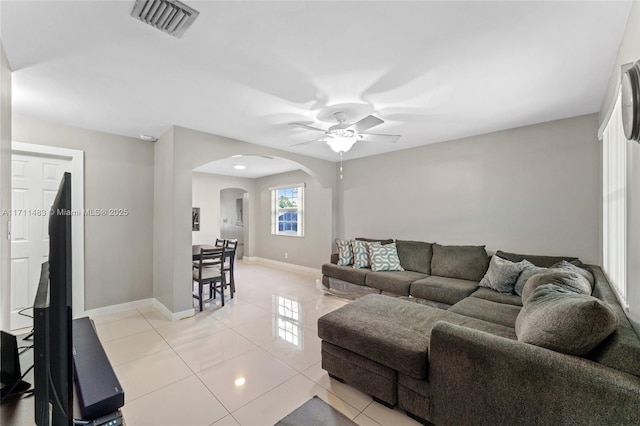 living room featuring ceiling fan and light tile patterned flooring