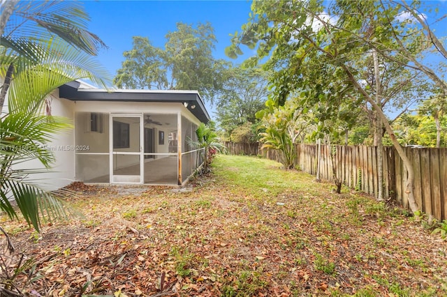 view of yard featuring a sunroom