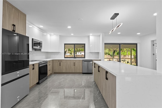 kitchen with white cabinetry, stainless steel appliances, tasteful backsplash, decorative light fixtures, and light brown cabinetry