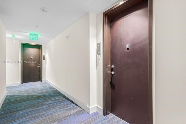 corridor featuring carpet flooring