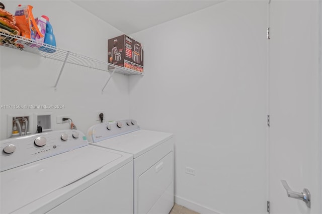 laundry area with washing machine and dryer