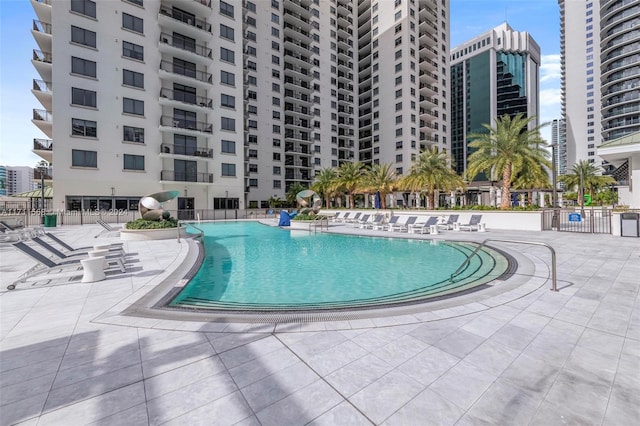 view of swimming pool featuring a patio area