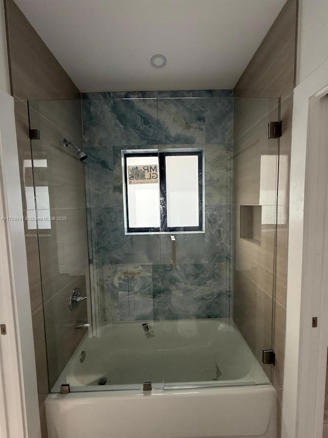 bathroom featuring enclosed tub / shower combo