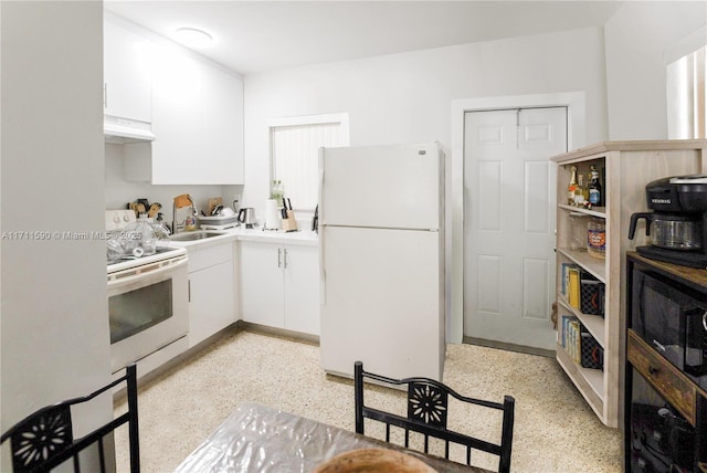 kitchen with white cabinetry, white appliances, light speckled floor, under cabinet range hood, and a sink