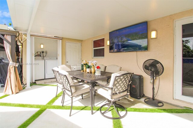 view of patio / terrace with washing machine and clothes dryer