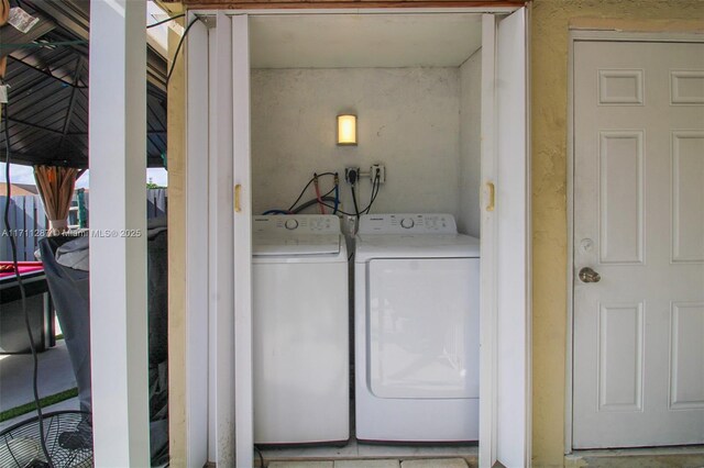 laundry area with washer and clothes dryer