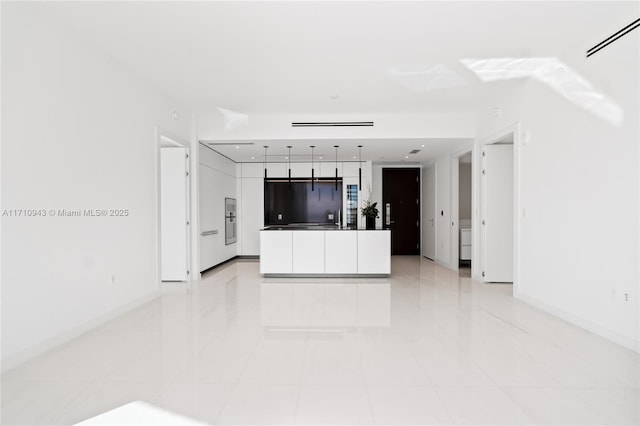 unfurnished living room with light tile patterned floors