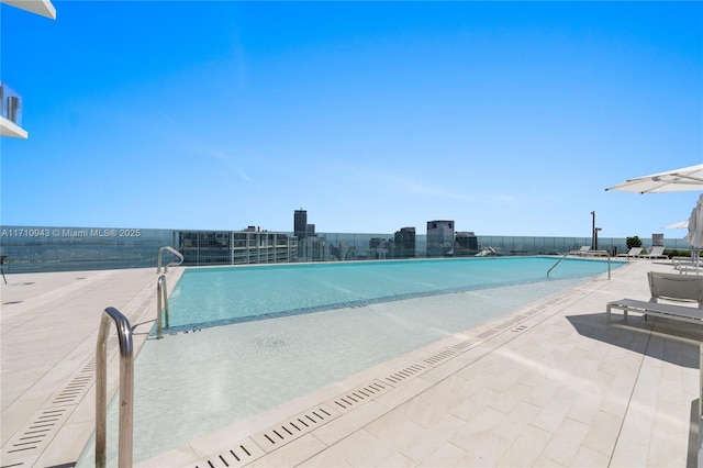 view of pool featuring a patio