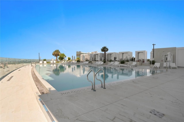 view of swimming pool featuring a patio area