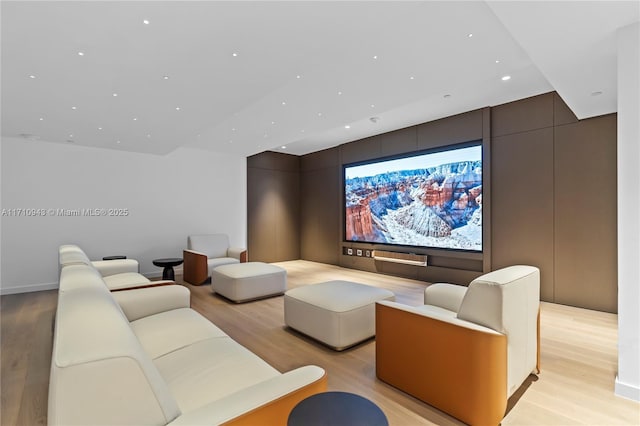 home theater room featuring light hardwood / wood-style flooring