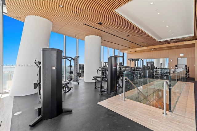 gym featuring expansive windows and wood ceiling