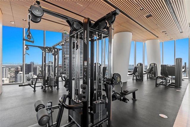 gym with a wall of windows