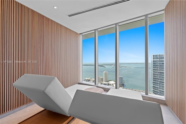 interior space featuring floor to ceiling windows and a water view