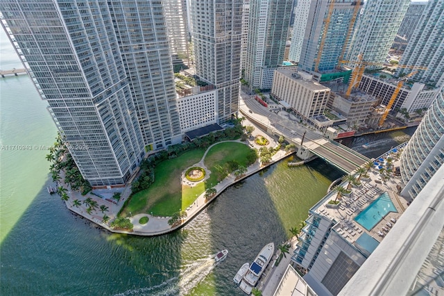 birds eye view of property with a water view