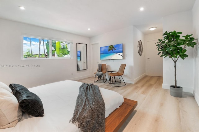 bedroom with light hardwood / wood-style floors