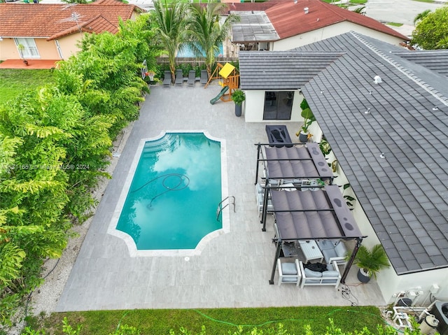 view of pool featuring a pergola and a patio area