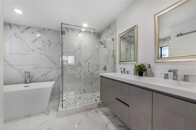 bathroom with vanity and separate shower and tub