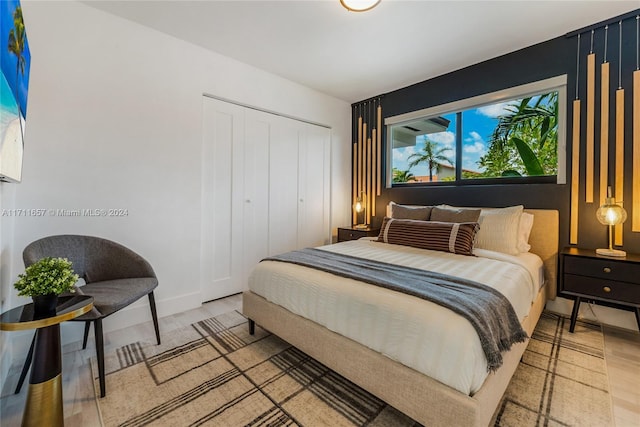 bedroom featuring a closet and hardwood / wood-style flooring