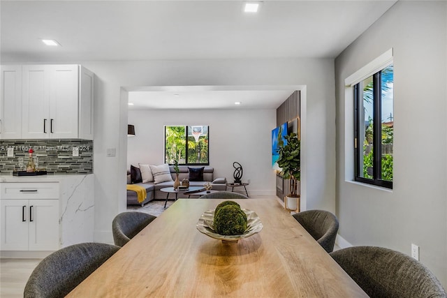 dining space featuring light wood-type flooring