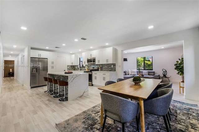 dining room featuring light hardwood / wood-style floors