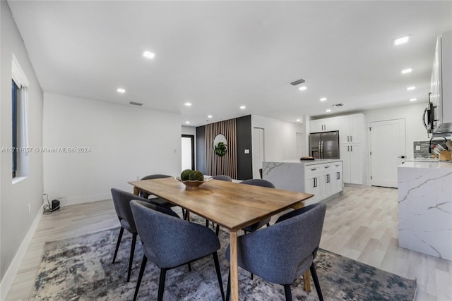 dining room featuring light hardwood / wood-style floors