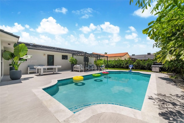 view of pool featuring a patio and area for grilling