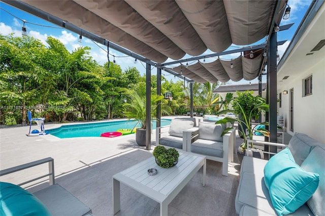 view of swimming pool featuring a patio and an outdoor hangout area