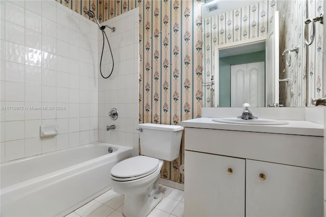 full bathroom with toilet, vanity, tile patterned floors, and tiled shower / bath