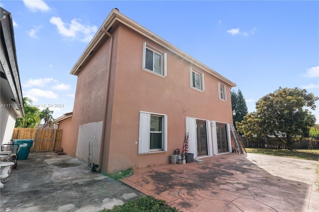 rear view of house with a patio