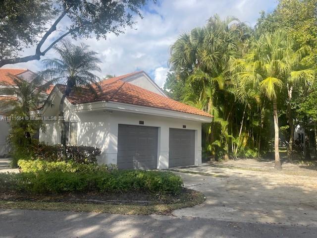 view of property exterior featuring a garage