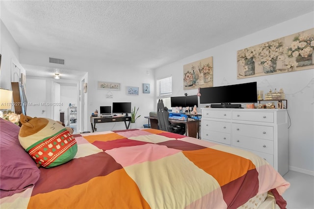 bedroom featuring a textured ceiling