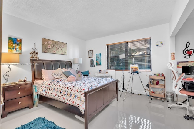 bedroom featuring a textured ceiling