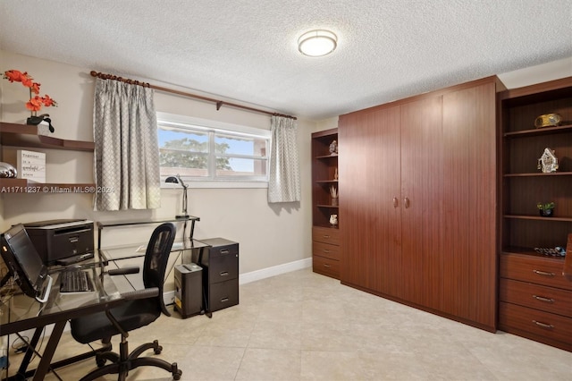 office area with a textured ceiling