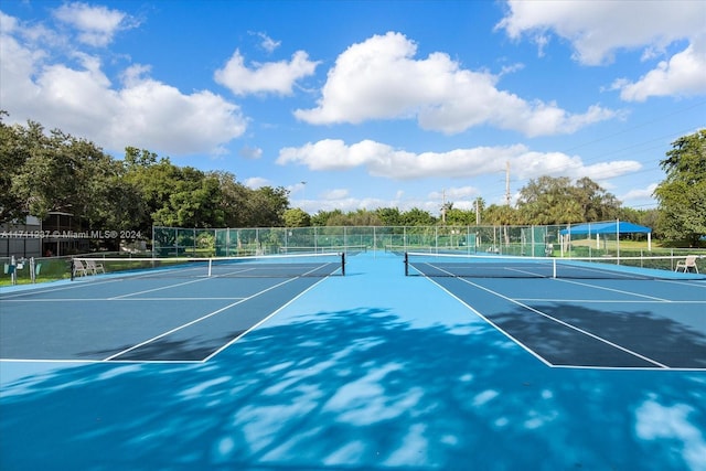 view of sport court with basketball hoop